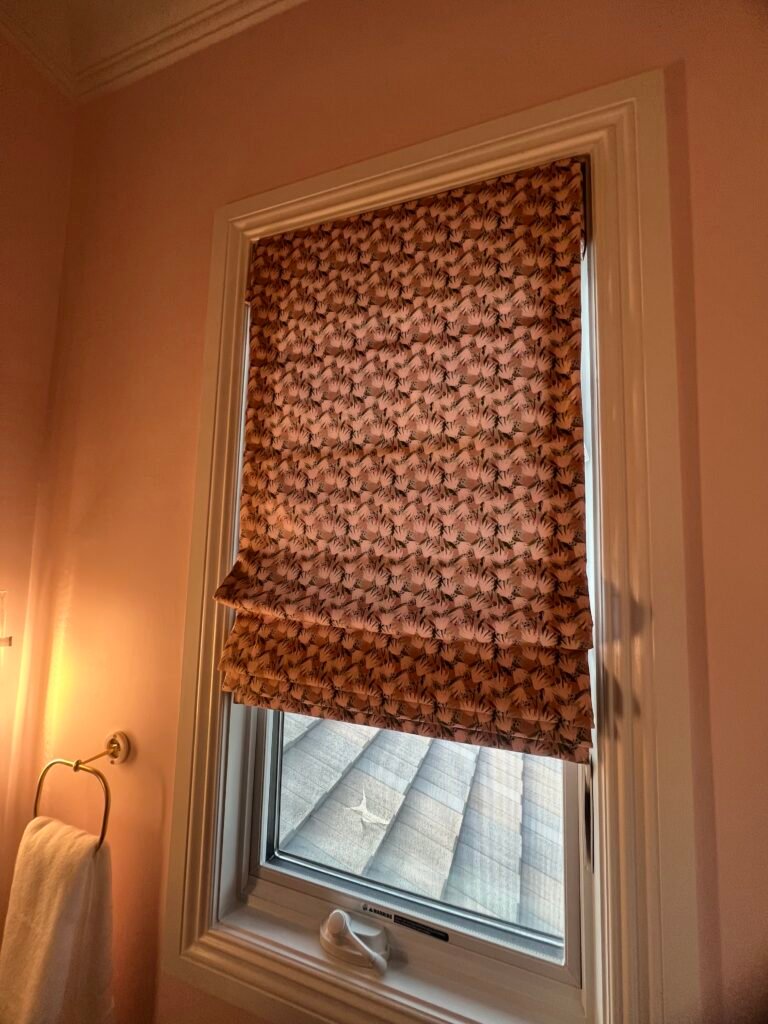 roman shades adding softness and texture to a cozy interior