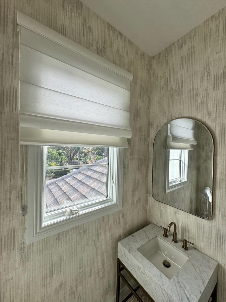 roller shades and roman shades showing the difference in style and texture